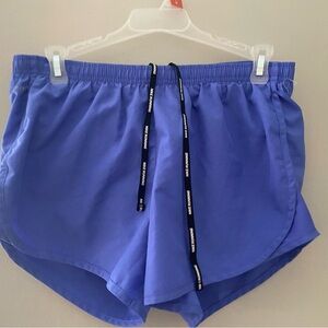 Nike Blue Athletic Shorts with Dolphin Hem